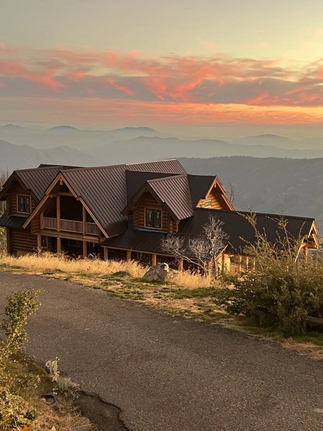 Close-up of notched log corner joinery on a log home wall at sunset