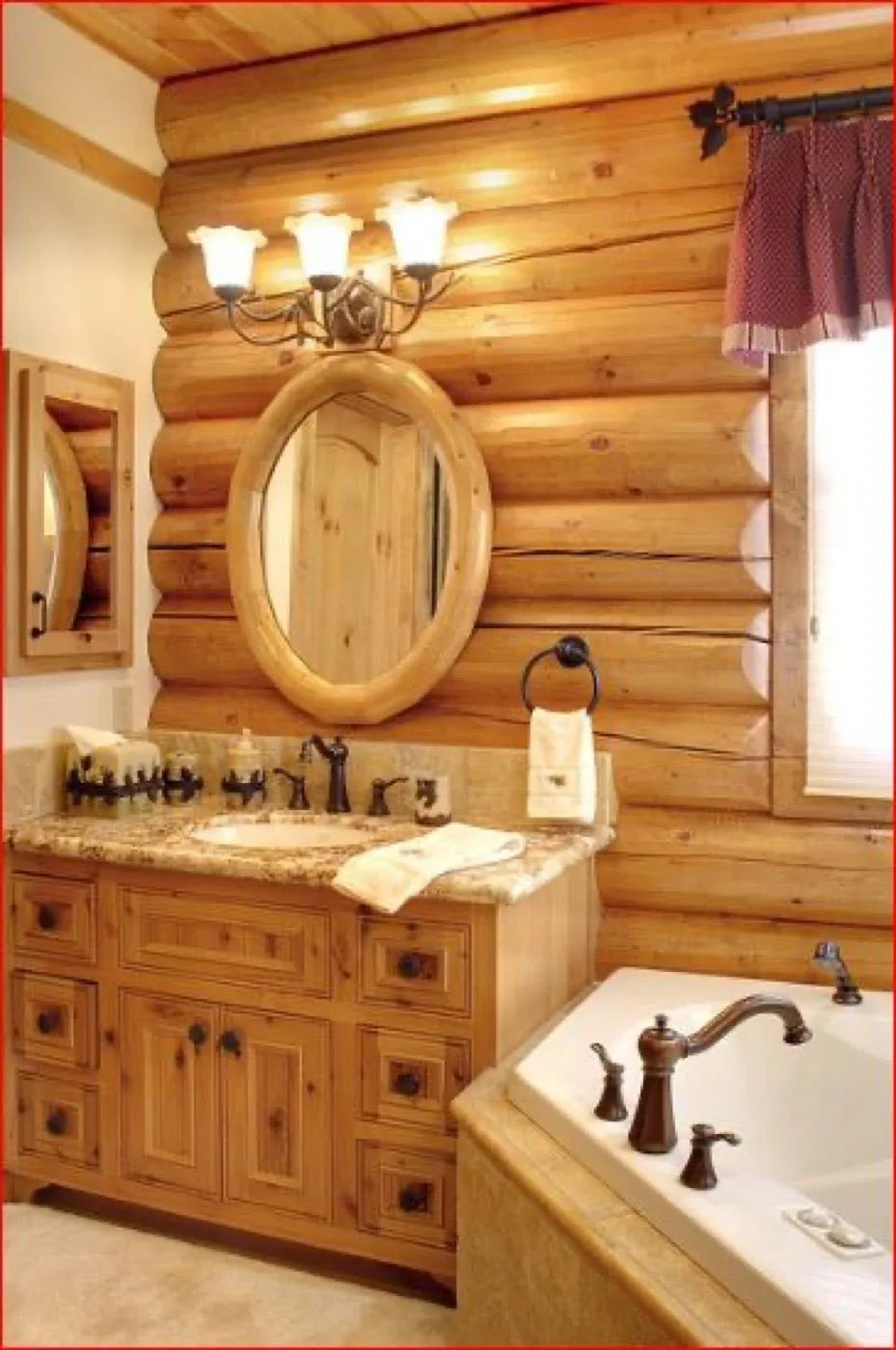 Log home bathroom with an oval log-framed mirror, granite vanity, and corner soaking tub